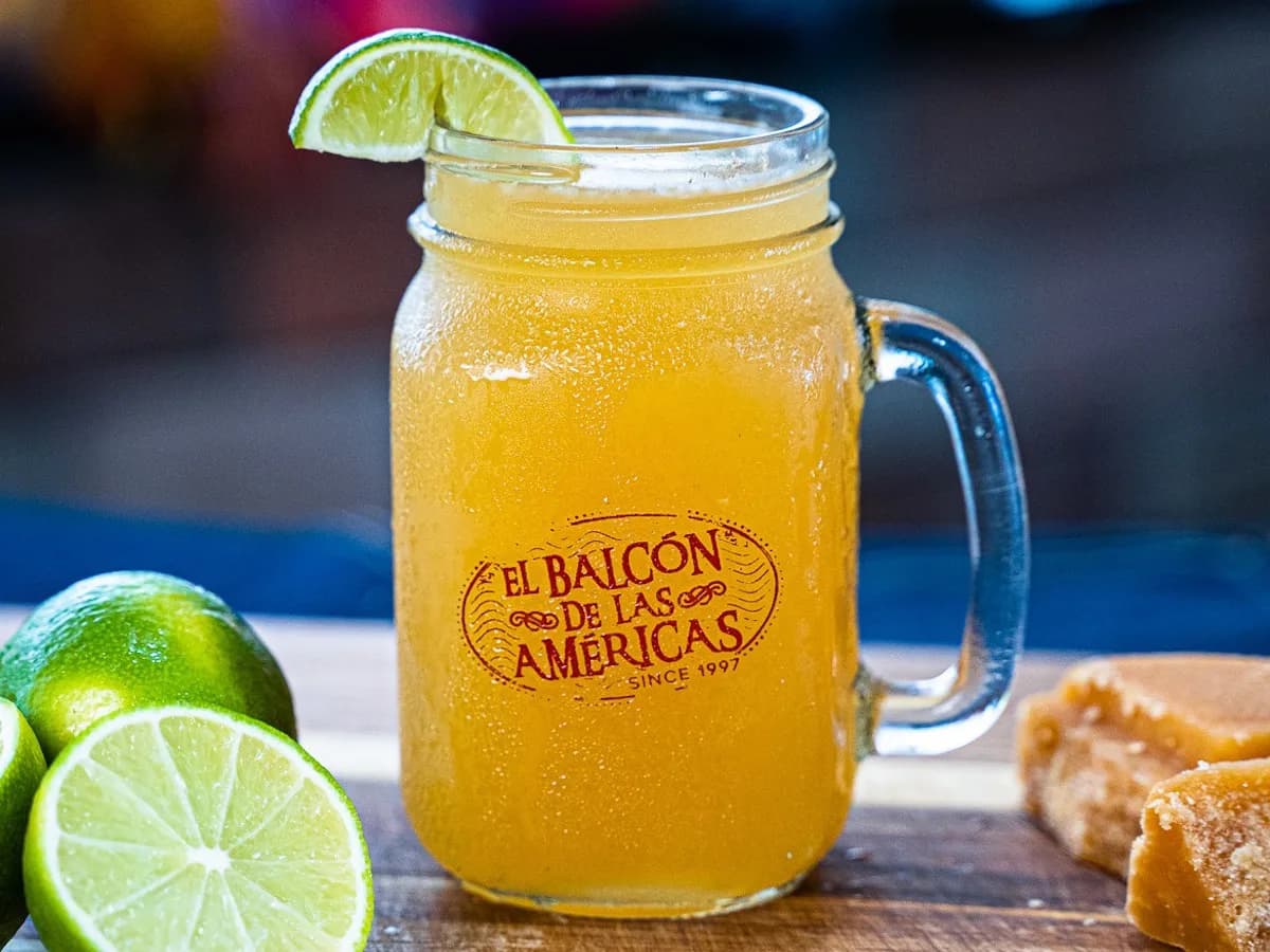 A glass of agua de panela